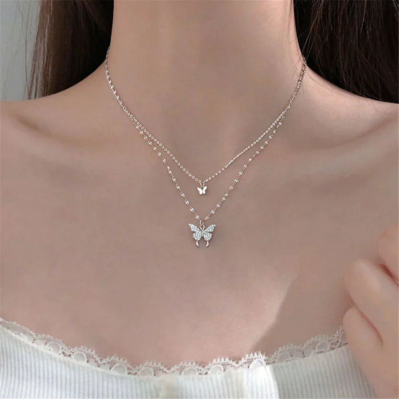 Silver necklace with glittering butterfly