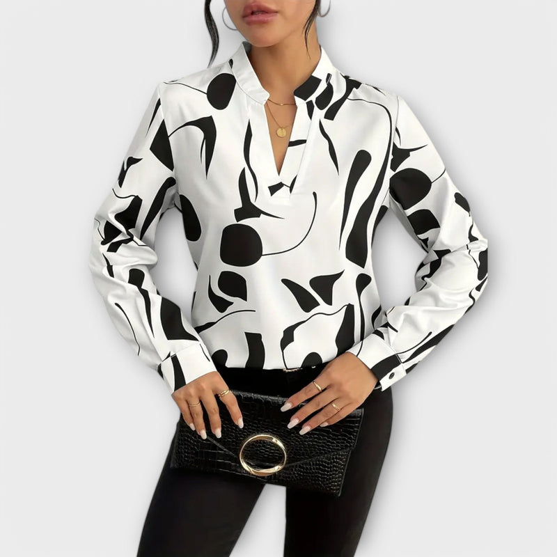 Elegant blouse with long sleeves and pointed neckline